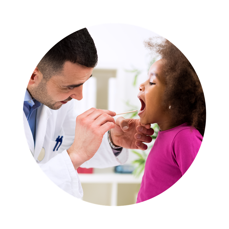 doctor making sure child is healthy by checking her throat